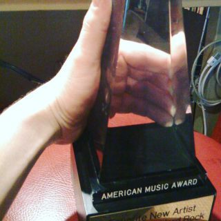 In honor of the American Music Awards tonight, here is a shot of me holding Pearl Jam’s AMA from when I worked for them in PJHQ. It was just kind of lying around 🤷‍♂️
